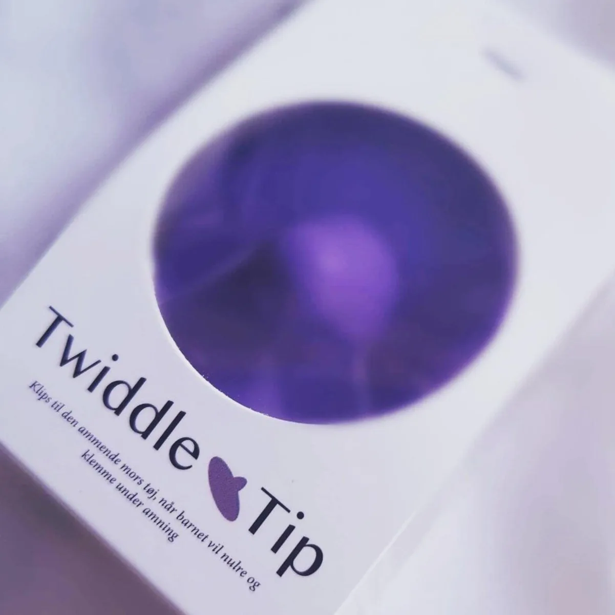 TwiddleTip-Verpackung mit sichtbarem violettem Produkt
